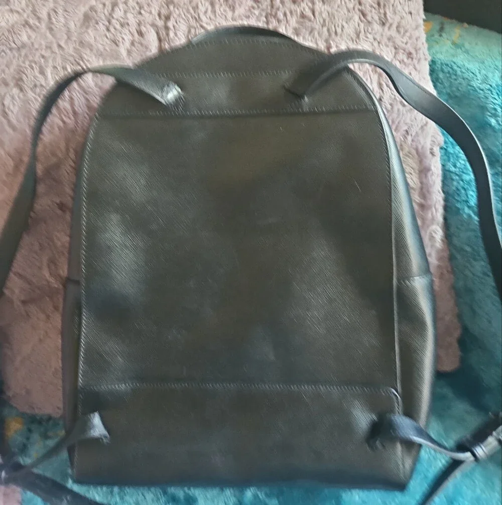 AS-IS Kate Spade black leather backpack LEFT STRAP AT THE TOP TORN. STILL NEW